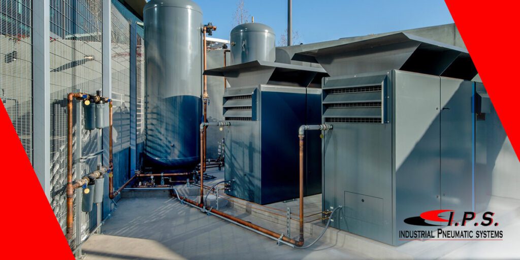 several industrial air compressors outdoors