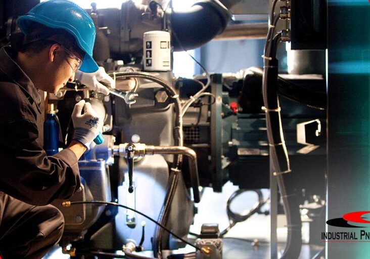 01-importance-of-industrial-air-compressor-preventive-maintenance-REV01 Atlas Copco technician working on an air compressor
